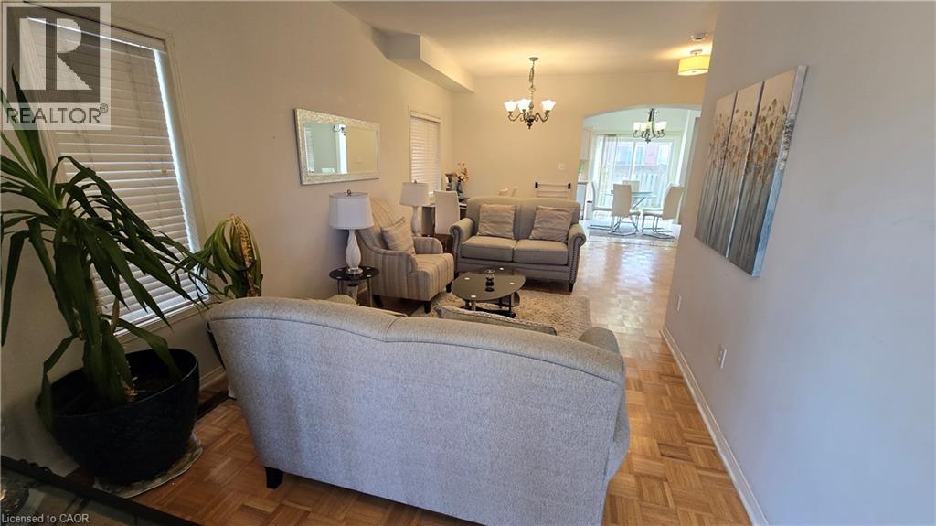 Living room featuring a chandelier and baseboards - 3688 Emery Drive, Mississauga, ON - Indoor