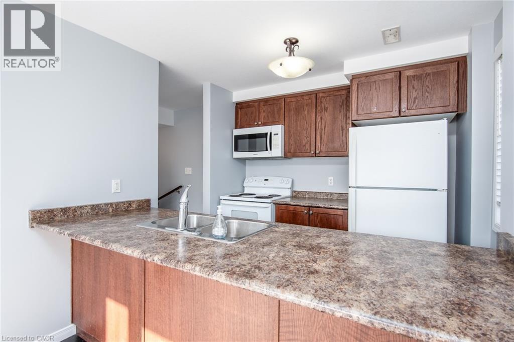 234 Rachel Crescent Unit# E, Kitchener, ON - Indoor Photo Showing Kitchen With Double Sink