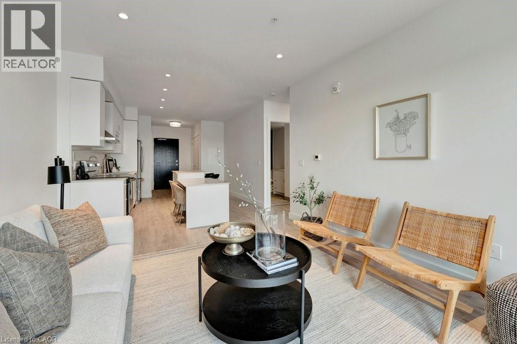 Living area featuring light wood-style flooring and recessed lighting - 15 Glebe Street Unit# 1511, Cambridge, ON - Indoor Photo Showing Living Room