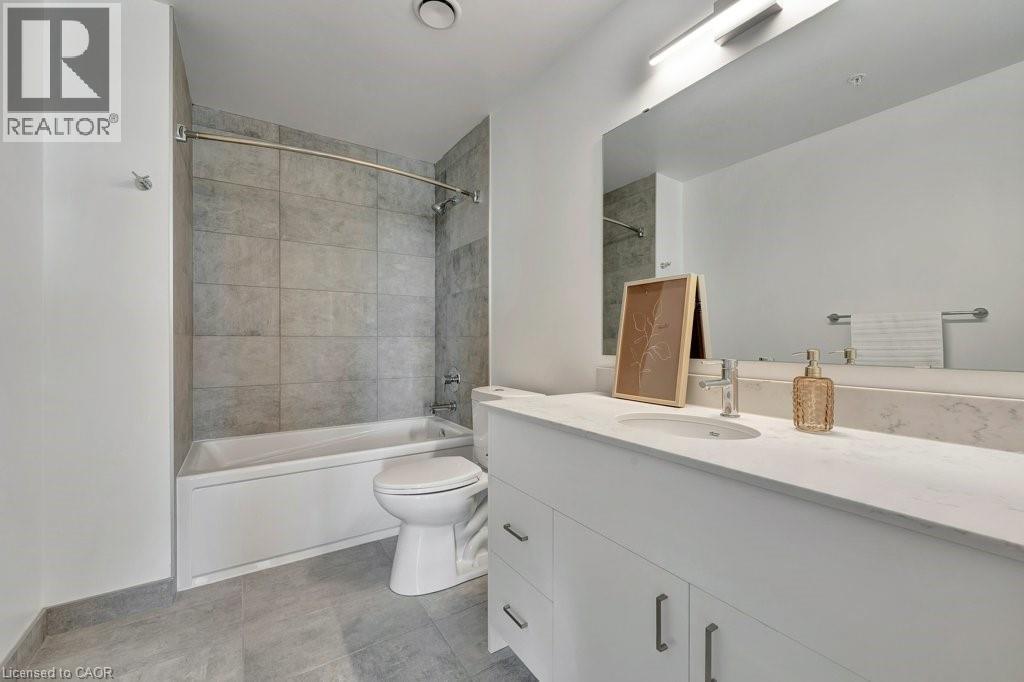 Bathroom with vanity and washtub / shower combination - 15 Glebe Street Unit# 1511, Cambridge, ON - Indoor Photo Showing Bathroom