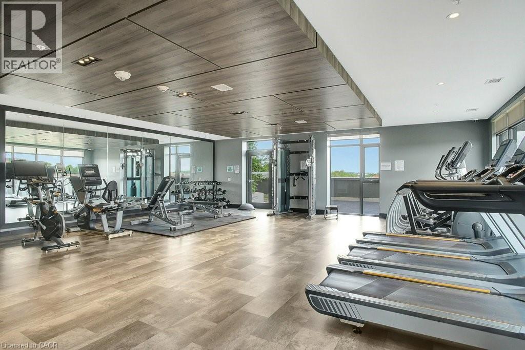 Exercise room with wood finished floors - 15 Glebe Street Unit# 1511, Cambridge, ON - Indoor Photo Showing Gym Room