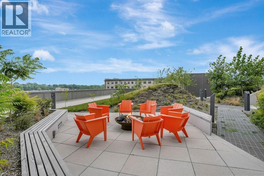 View of patio featuring a fire pit - 15 Glebe Street Unit# 1511, Cambridge, ON - Outdoor