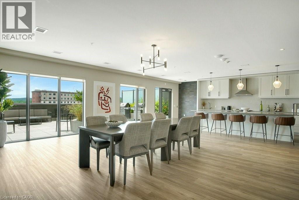 Dining room featuring healthy amount of natural light, a chandelier, light wood-style floors, and recessed lighting - 15 Glebe Street Unit# 1511, Cambridge, ON - Indoor Photo Showing Dining Room