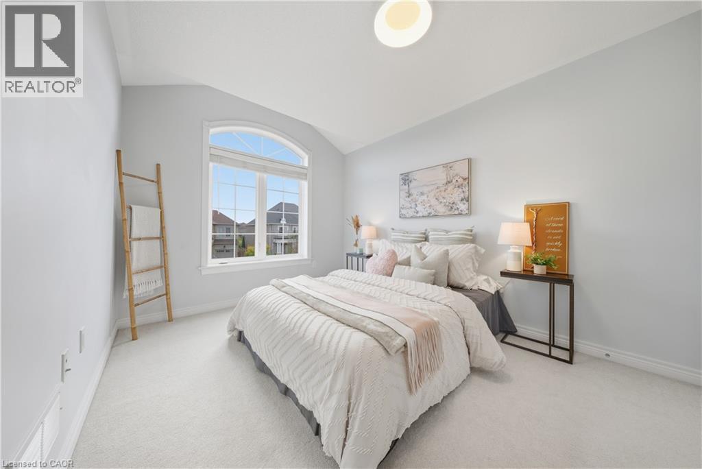Carpeted bedroom with vaulted ceiling and baseboards - 8 Summerberry Way, Hamilton, ON - Indoor Photo Showing Bedroom