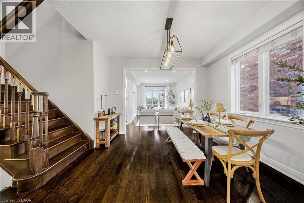 Dining space featuring stairway and hardwood / wood-style flooring - 8 Summerberry Way, Hamilton, ON - Indoor