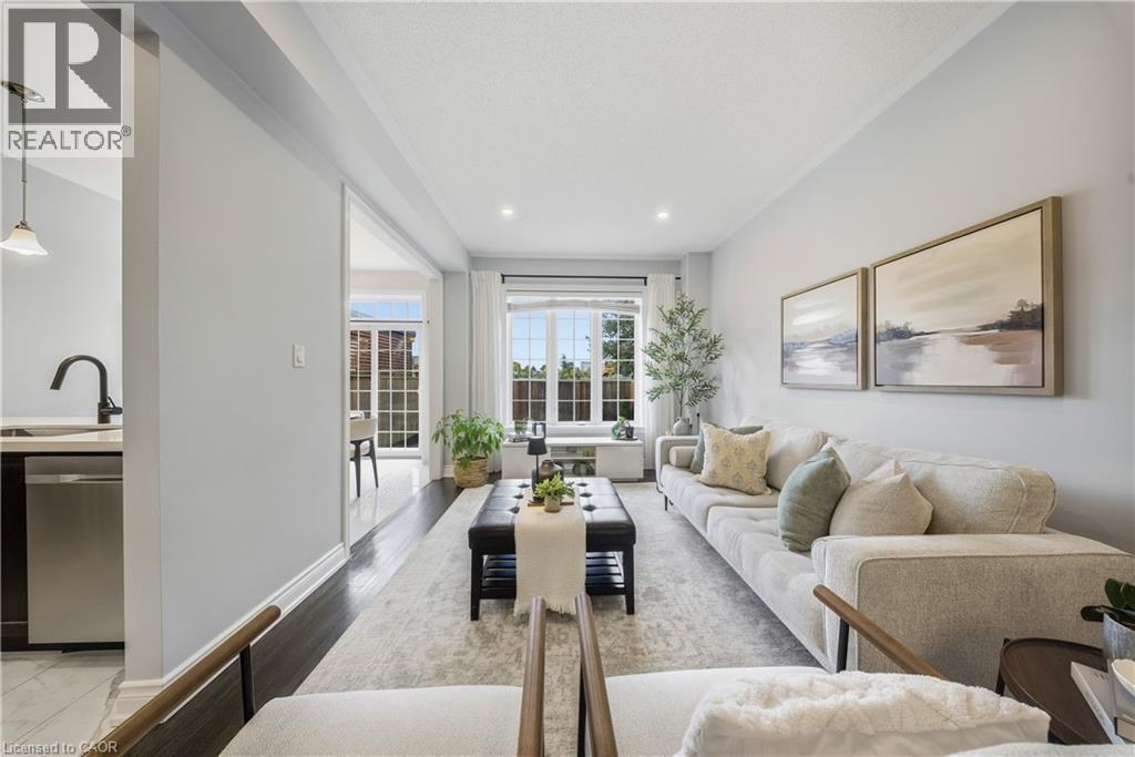 Living area with light wood finished floors and recessed lighting - 8 Summerberry Way, Hamilton, ON - Indoor Photo Showing Living Room