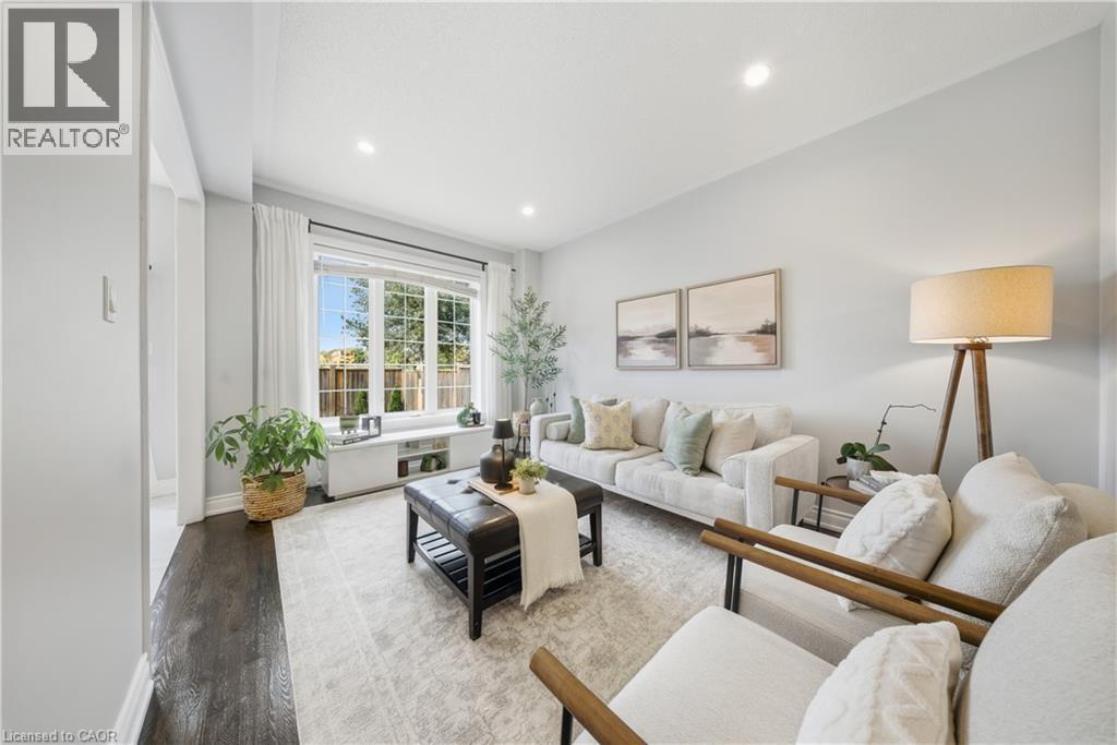 Living room with wood finished floors and recessed lighting - 8 Summerberry Way, Hamilton, ON - Indoor Photo Showing Living Room