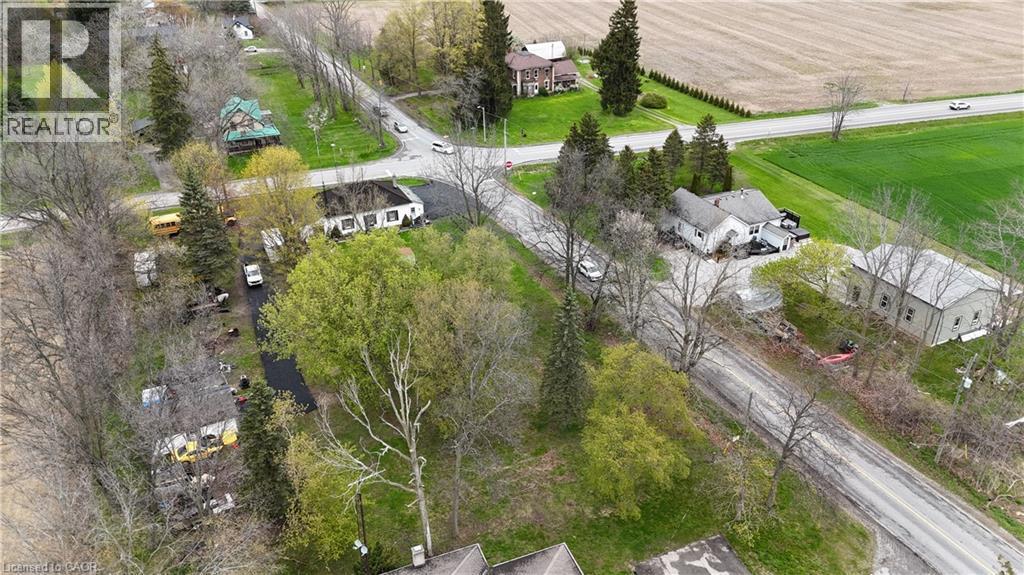 Aerial perspective showcasing a residential property with surrounding green spaces - 740 Hillcrest Road, Simcoe, ON - Outdoor With View