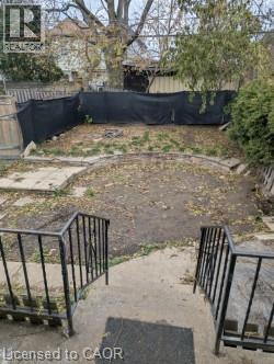 Fenced backyard featuring a patio area - 151 Gibson Avenue, Hamilton, ON - Outdoor