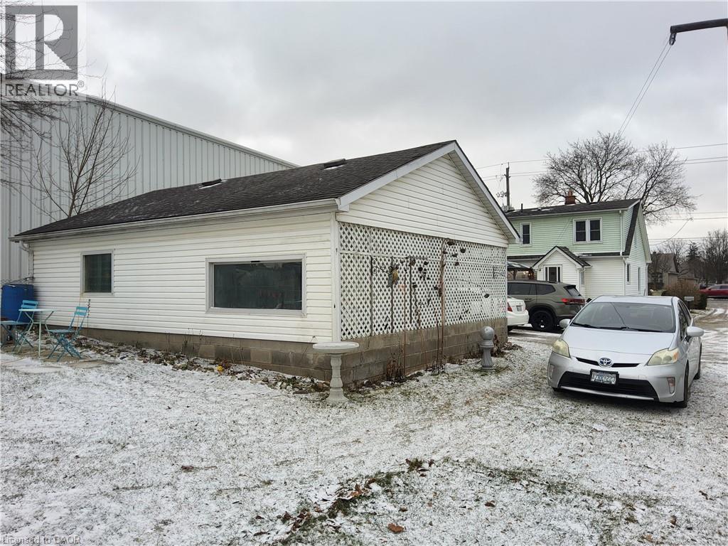 Back of garage showing lots of available parking - 509 Queensway W, Simcoe, ON - Outdoor With Exterior