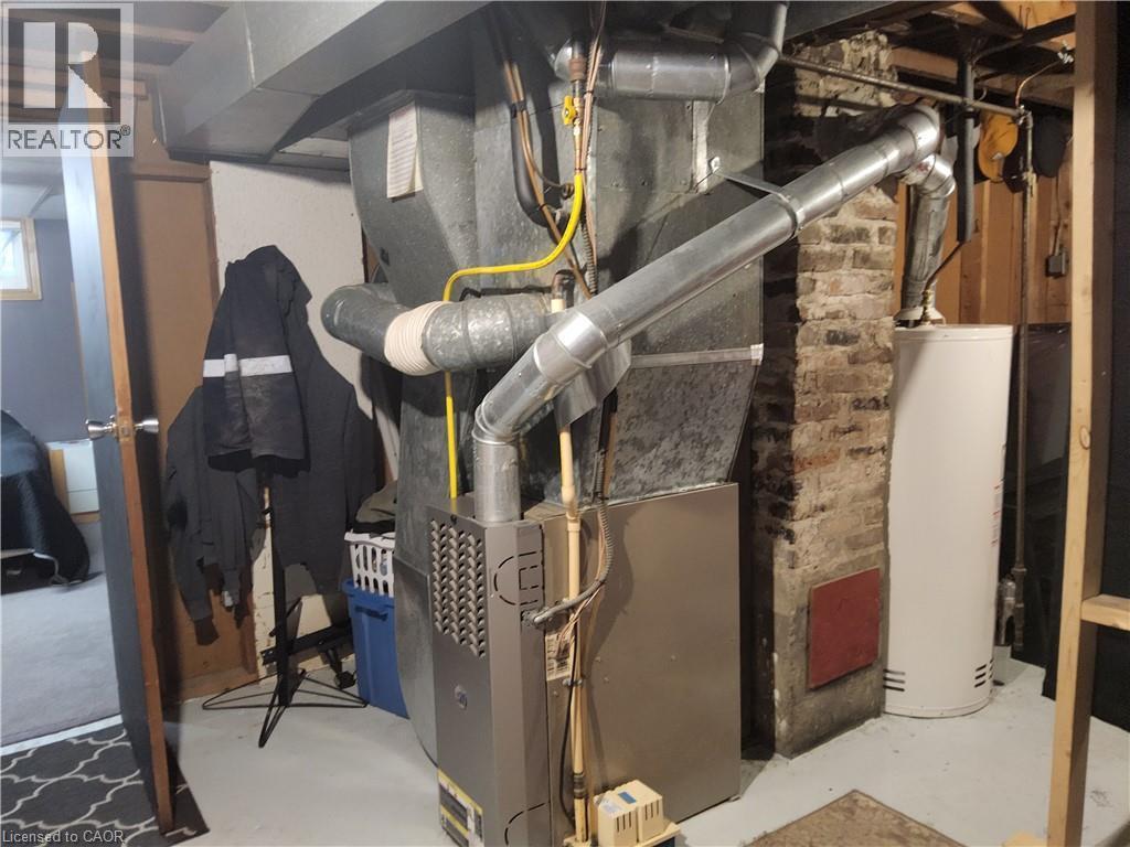 Utilities with heating unit and water heater - 509 Queensway W, Simcoe, ON - Indoor Photo Showing Basement