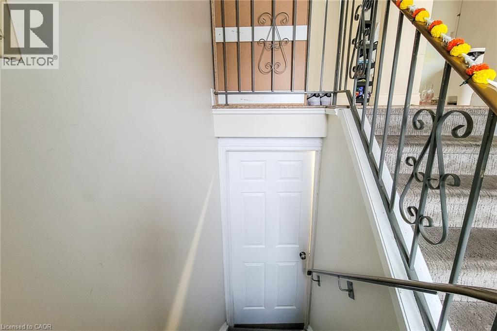 Stairway with healthy amount of natural light - 758 Stone Church Road E, Hamilton, ON - Indoor Photo Showing Other Room
