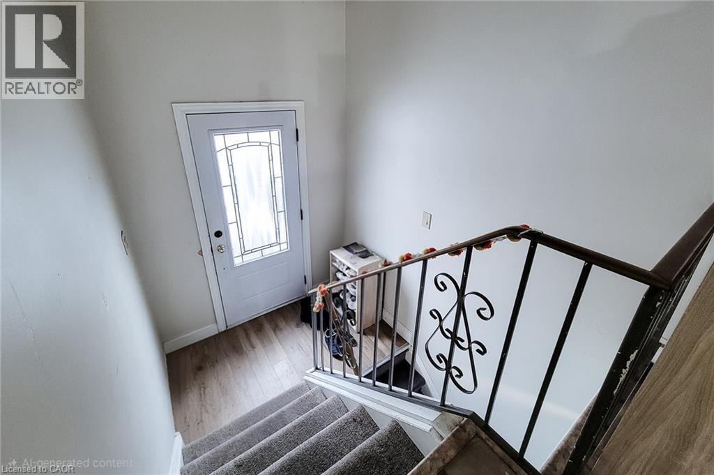 Entryway with stairway and wood finished floors - 758 Stone Church Road E, Hamilton, ON - Indoor Photo Showing Other Room