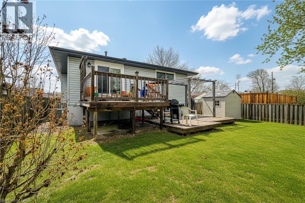Back of property featuring a shed, a deck, and a fenced backyard - 758 Stone Church Road E, Hamilton, ON - Outdoor With Deck Patio Veranda
