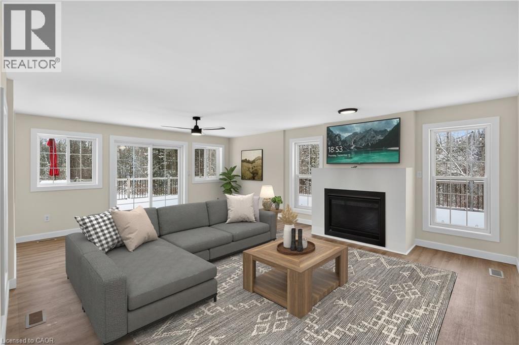 Virtually staged family room - 7460 5Th Line, Essa, ON - Indoor Photo Showing Living Room With Fireplace