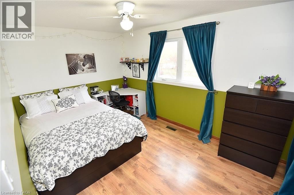 Bedroom with light wood-type flooring and ceiling fan - 43 Niska Drive, Waterdown, ON - Indoor Photo Showing Bedroom