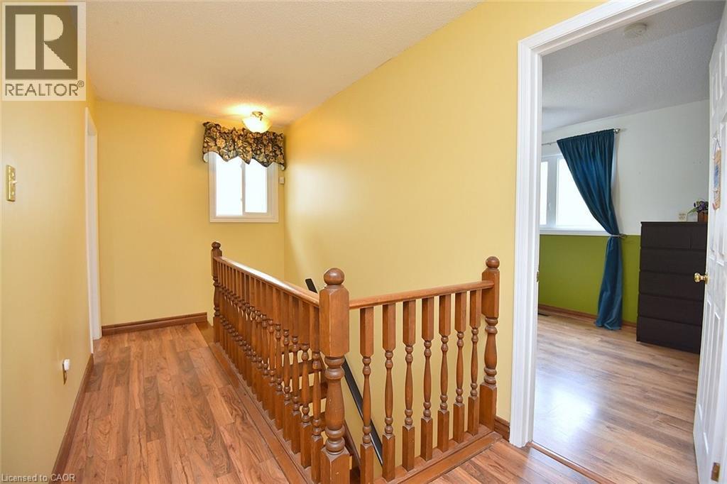 Stairs with wood finished floors and baseboards - 43 Niska Drive, Waterdown, ON - Indoor Photo Showing Other Room
