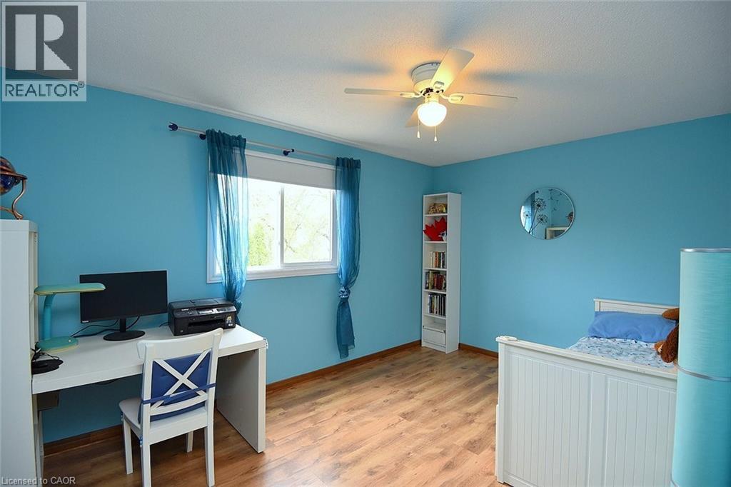 Bedroom featuring a desk, a ceiling fan, light wood-style floors, and a textured ceiling - 43 Niska Drive, Waterdown, ON - Indoor Photo Showing Office