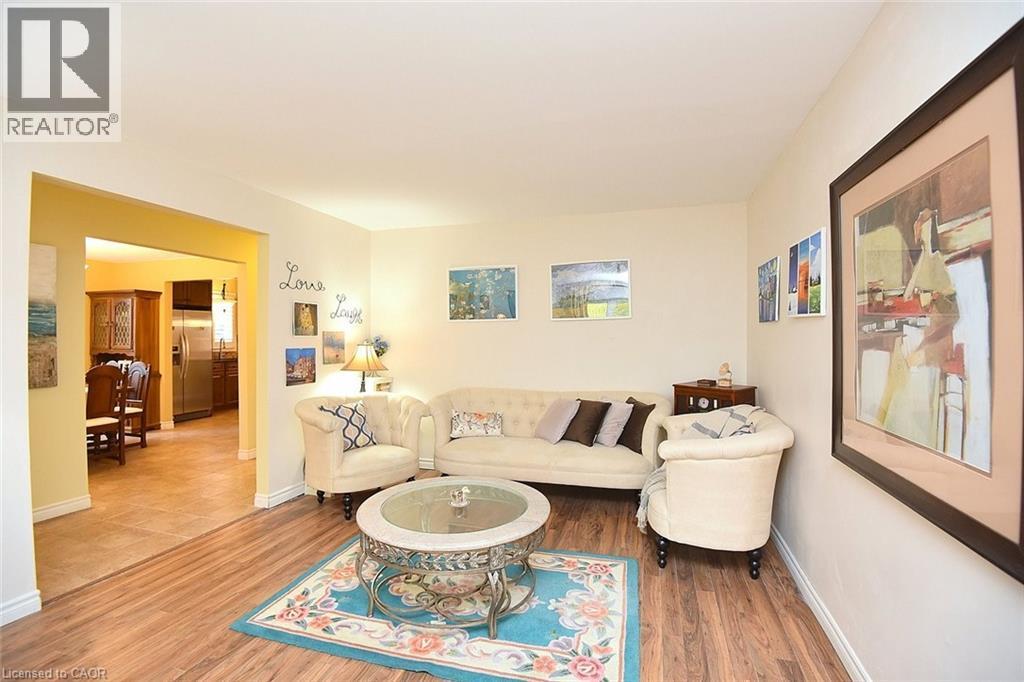 Living area with wood finished floors and baseboards - 43 Niska Drive, Waterdown, ON - Indoor Photo Showing Living Room