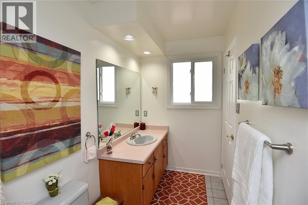 Bathroom featuring vanity, light tile patterned flooring, and recessed lighting - 43 Niska Drive, Waterdown, ON - Indoor Photo Showing Bathroom