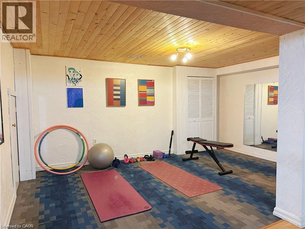 Workout area featuring wooden ceiling and a textured wall - 43 Niska Drive, Waterdown, ON - Indoor