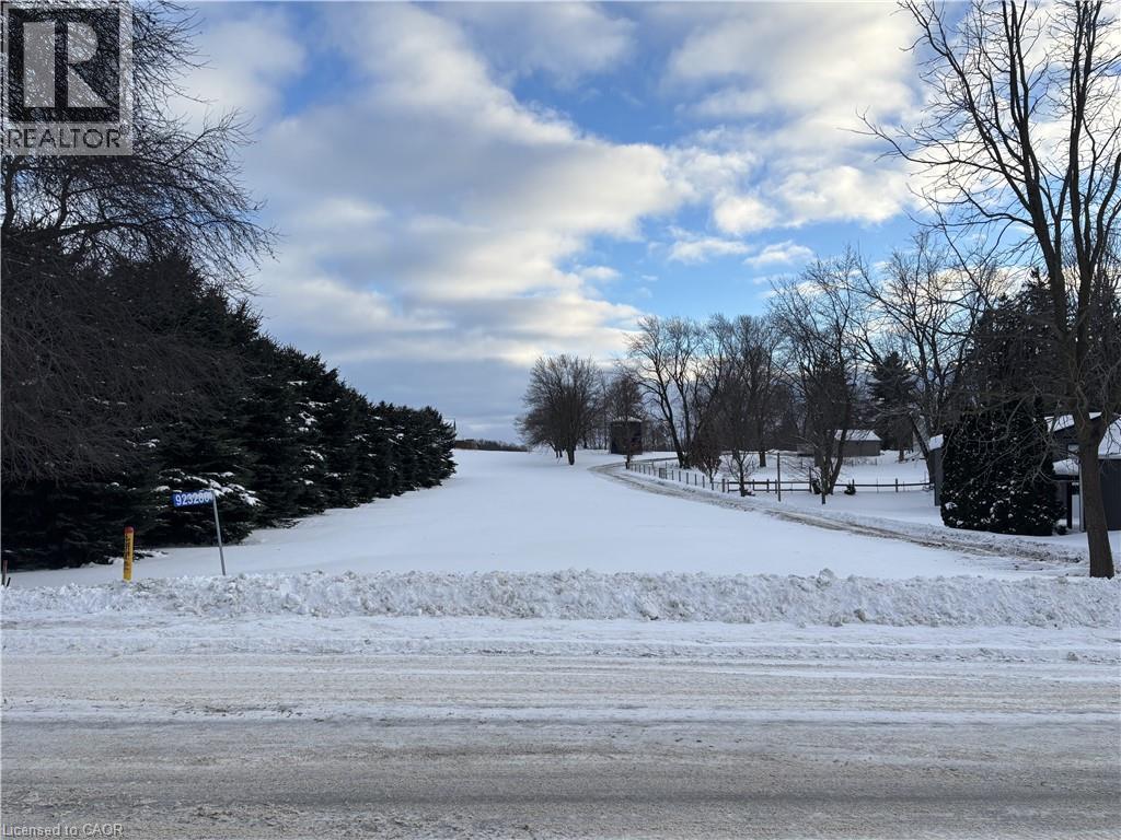 View of yard layered in snow - 923280 Road 92, Lakeside, ON