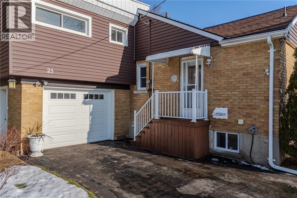 Side door and garage - 25 Charlton Crescent, Simcoe, ON - Outdoor With Exterior