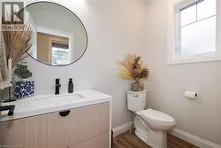 Bathroom with vanity and dark wood finished floors -