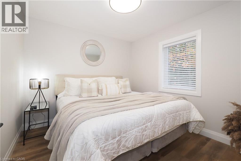Bedroom featuring baseboards and dark wood-style flooring - 238 Eagle Street S, Cambridge, ON - Indoor Photo Showing Bedroom