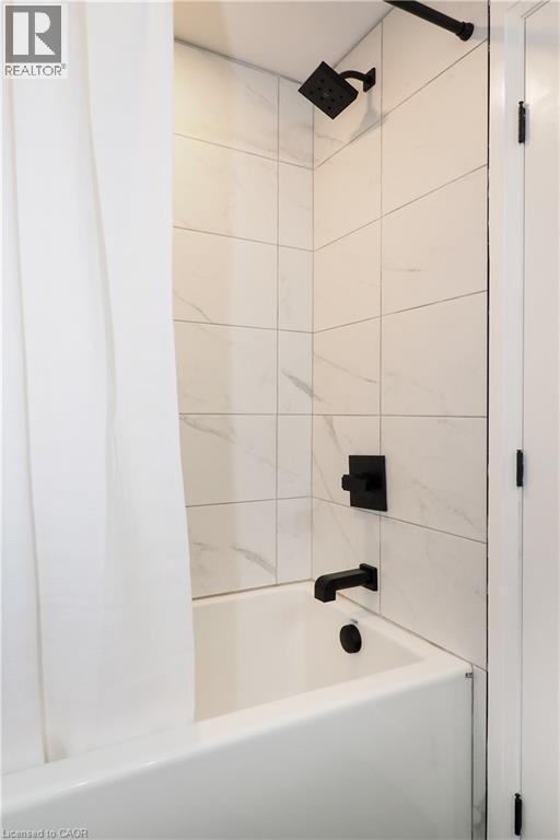 Full bathroom featuring washtub / shower combination - 238 Eagle Street S, Cambridge, ON - Indoor Photo Showing Bathroom