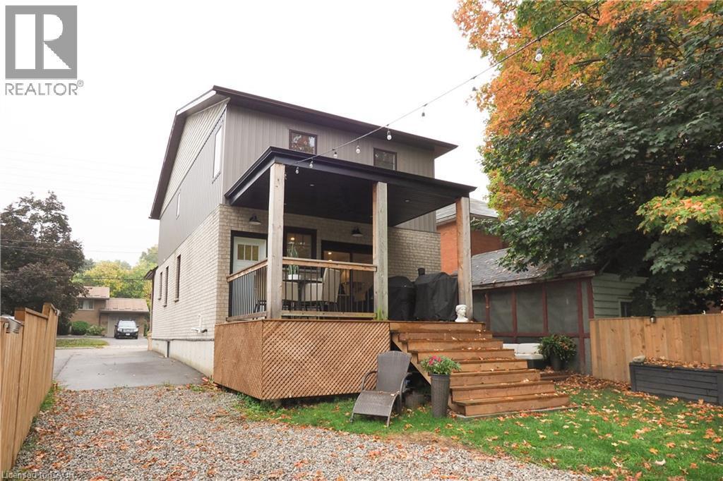 Rear view of property with brick siding, a wooden deck, and stairway - 238 Eagle Street S, Cambridge, ON - Outdoor With Deck Patio Veranda