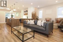 Living room featuring recessed lighting, light wood finished floors, and wine cooler -