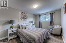 Bedroom with wood finished floors -