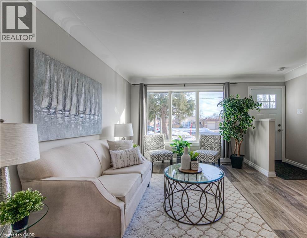 Living room featuring wood finished floors and baseboards - 156 Donald Street, Kitchener, ON - Indoor Photo Showing Living Room