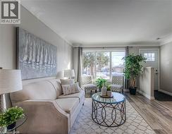 Living room featuring wood finished floors and baseboards -