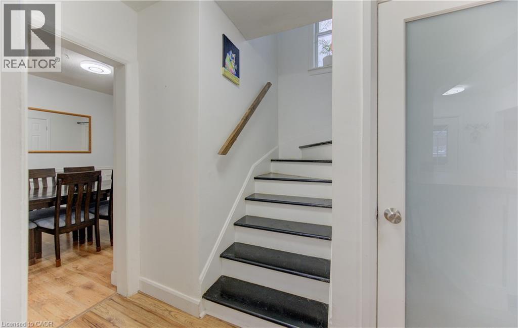 Stairs with wood finished floors and baseboards - 569 Stirling Avenue S, Kitchener, ON - Indoor Photo Showing Other Room
