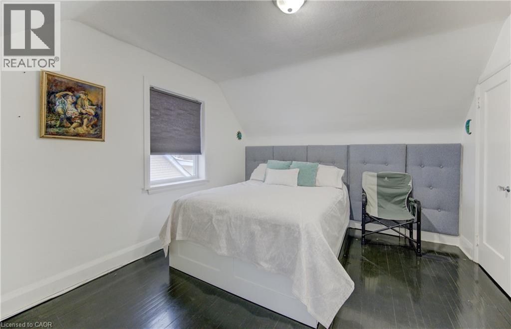 Bedroom featuring vaulted ceiling and dark wood-style floors - 569 Stirling Avenue S, Kitchener, ON - Indoor Photo Showing Bedroom