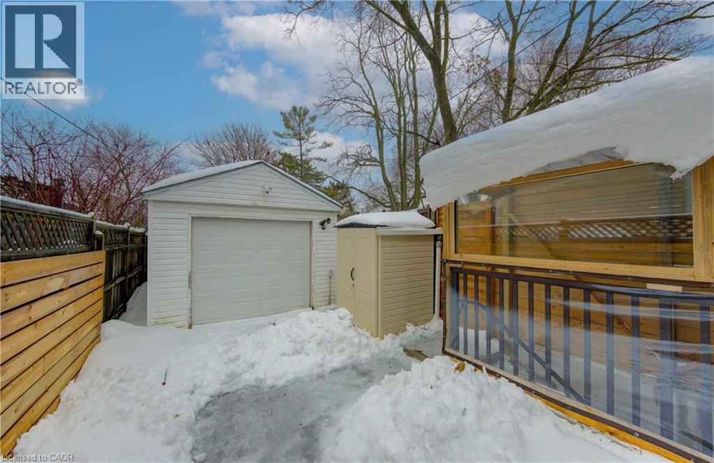Snow covered garage with a detached garage - 569 Stirling Avenue S, Kitchener, ON - Outdoor With Exterior