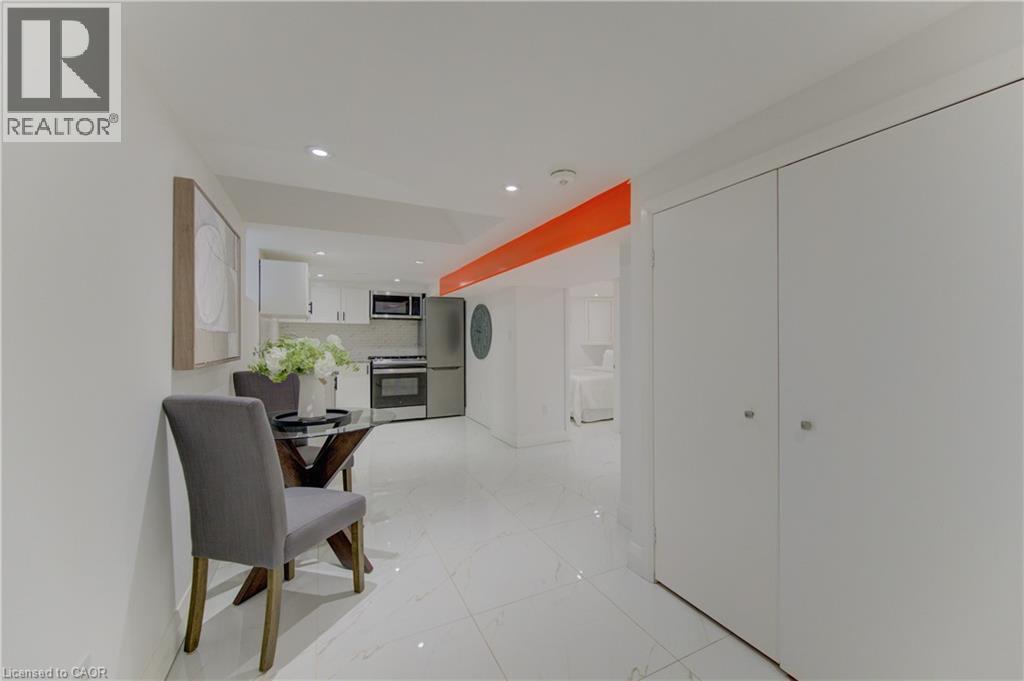 Hallway with recessed lighting and light marble finish floors - 569 Stirling Avenue S, Kitchener, ON - Indoor Photo Showing Other Room