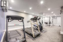Exercise area with recessed lighting and a wall mounted AC -