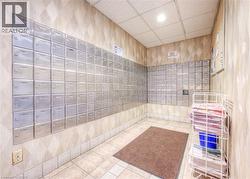 Full bathroom featuring mail area, a paneled ceiling, tiled shower, recessed lighting, and a relaxing sauna -
