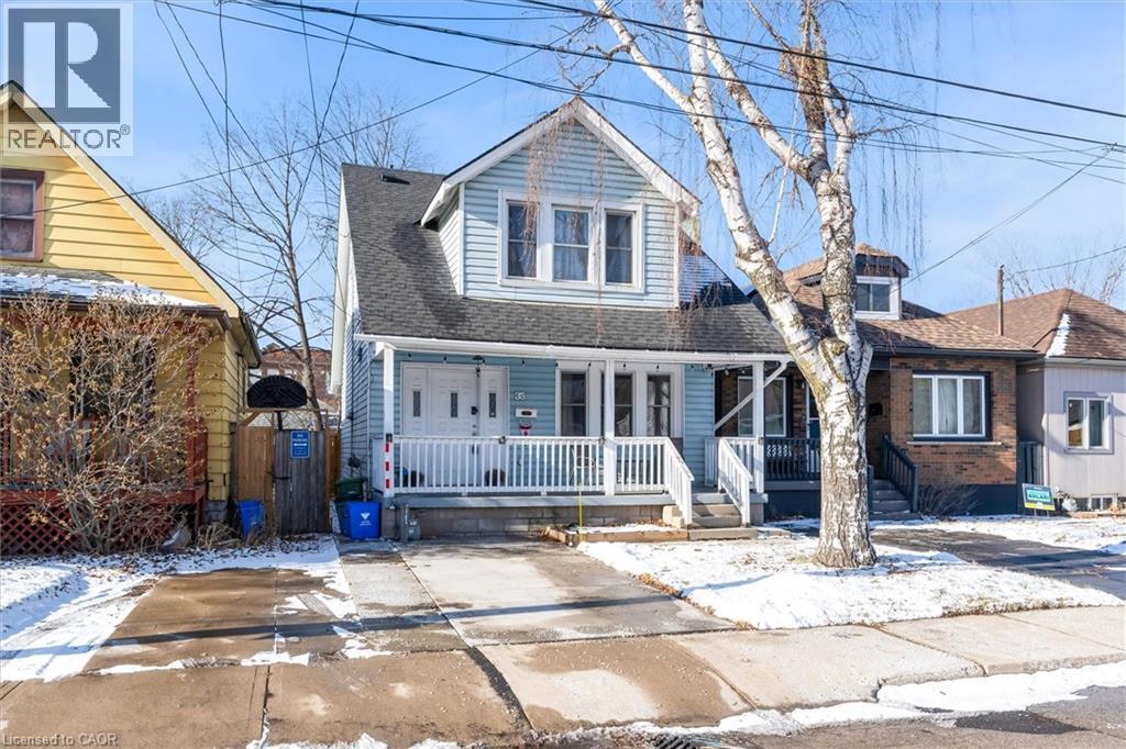 View of front facade featuring a porch and a shingled roof - 35 Bayfield Avenue, Hamilton, ON - Outdoor With Deck Patio Veranda With Facade