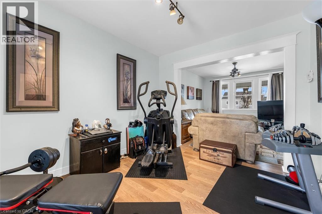 Workout area featuring light wood finished floors and a ceiling fan - 35 Bayfield Avenue, Hamilton, ON - Indoor Photo Showing Gym Room