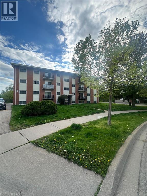 View of apartment building / complex - 145 Macgregor Crescent Unit# 1, Waterloo, ON - Outdoor With Facade
