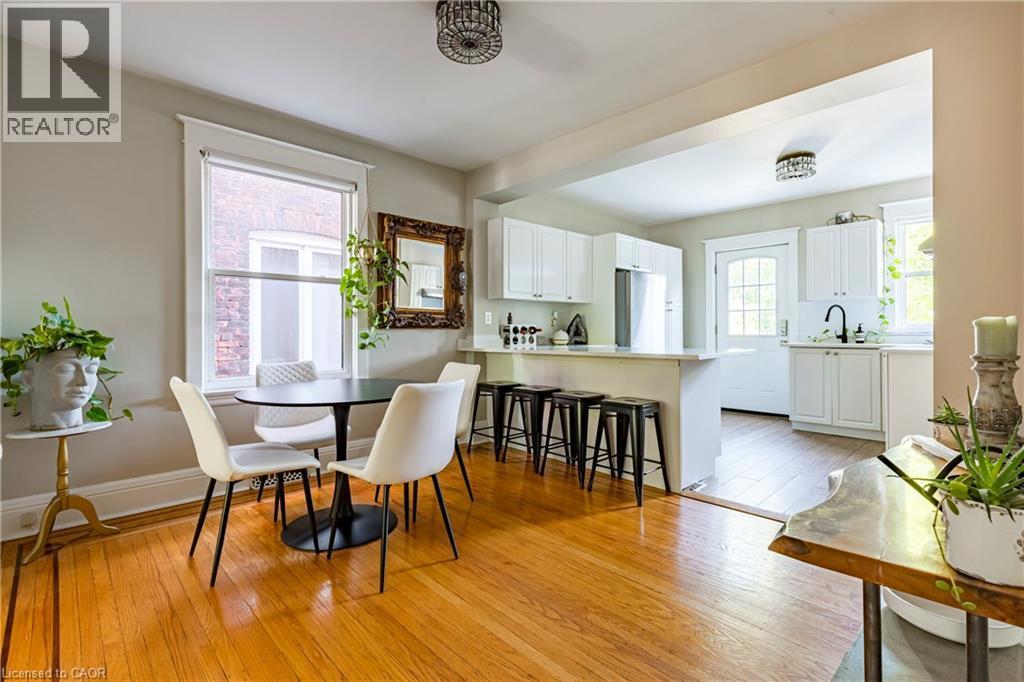 Dining room featuring light wood-style flooring and baseboards - 58 Chatham Street, Hamilton, ON - Indoor Photo Showing Dining Room