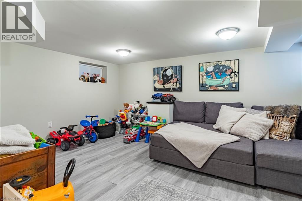 Recreation room featuring wood finished floors - 58 Chatham Street, Hamilton, ON - Indoor