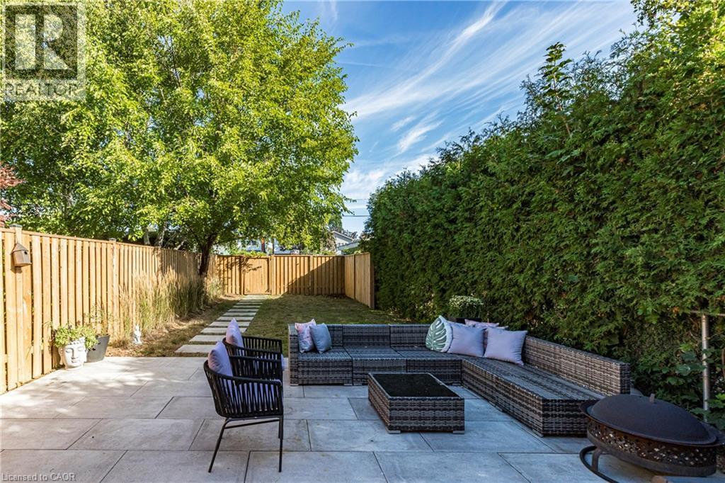 Fenced backyard featuring a patio area and an outdoor living space - 58 Chatham Street, Hamilton, ON - Outdoor With Deck Patio Veranda