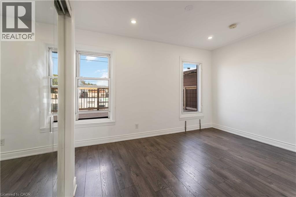 Spare room featuring dark wood-style flooring and recessed lighting - 934 Barton Street E Unit# 2, Hamilton, ON - Indoor Photo Showing Other Room