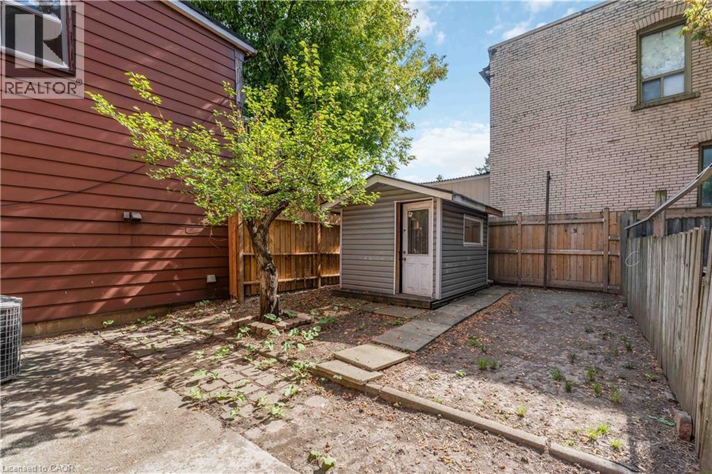 Fenced backyard featuring a storage shed - 934 Barton Street E Unit# 2, Hamilton, ON - Outdoor With Exterior