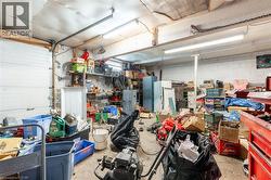 Garage featuring concrete block wall -